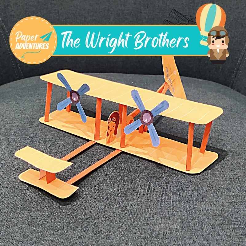 Paper adventure wright brothers plane model. Fun print-at-home activity for curious children. View of paper model on chair